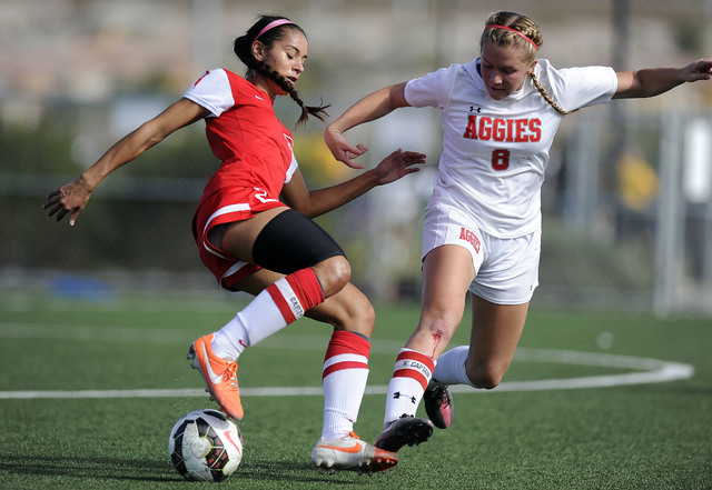 Coronado forward Michaela Morris (20) challenges Arbor View midfielder Breanna Larkin (8) du ...