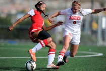 Coronado forward Michaela Morris (20) challenges Arbor View midfielder Breanna Larkin (8) du ...