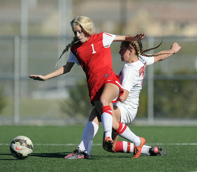 Arbor View midfielder Breanna Larkin, right, battles Coronado midfielder Carli Young (1) dur ...