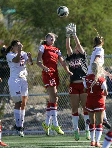 Coronado goalkeeper Shannon Heenan (6) makes a save in front of midfielder Taylor Kornieck ( ...