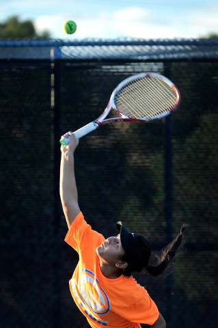 Bishop Gorman’s Amber Del Rosario serves the ball during the Sunset Region girls singl ...