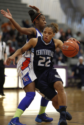 Centennial’s Teirra Hicks drives by Bishop Gorman’s Maddison Washington on Frida ...