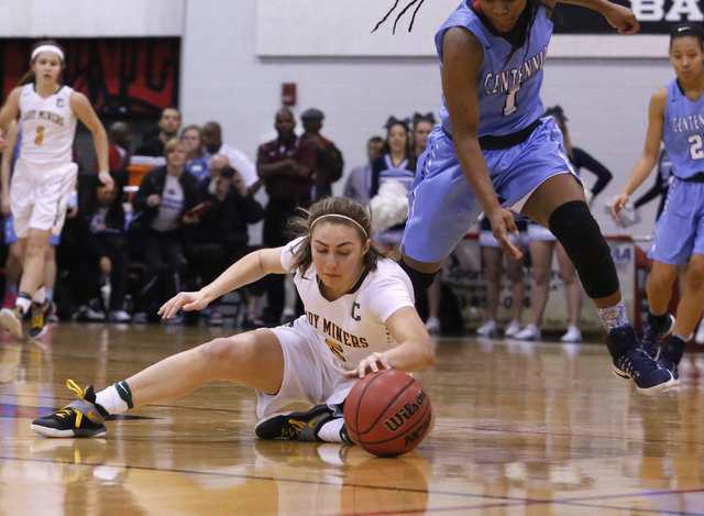 Bishop Manogue’s Malia Holt (5) recovers a loose ball over Centennial’s Pam Wilm ...