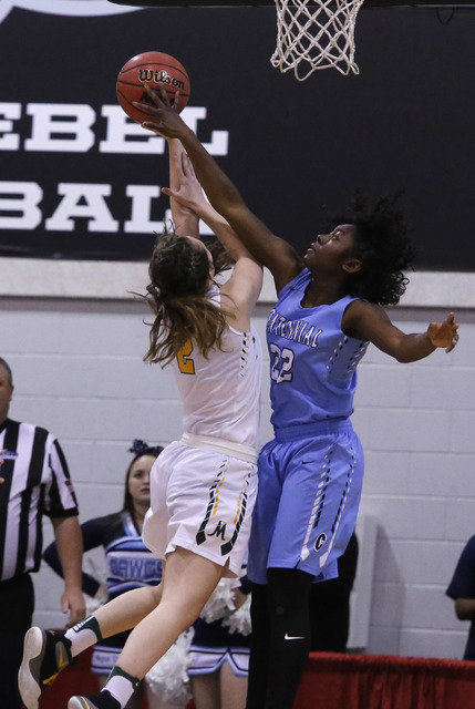 Centennial’s Eboni Walker (22) blocks a shot from Bishop Manogue’s Maddie Camach ...