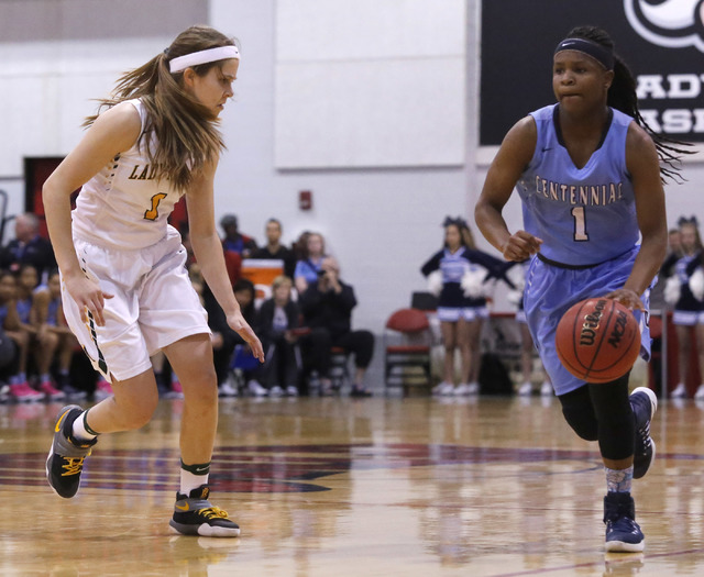 Centennial’s Pam Wilmore (1) dribbles pass Bishop Manogue’s Katie Turner (1) dur ...