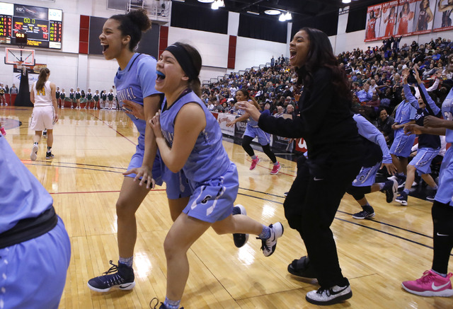 Centennial players celebrate after winning their third straight Class 4A girls state final c ...