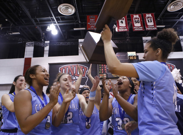 Centennial players celebrate after winning their third straight Class 4A girls state final c ...