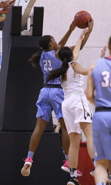 Centennial’s Daejah Phillips (23) grabs a rebound during the second half of a Class 4A ...