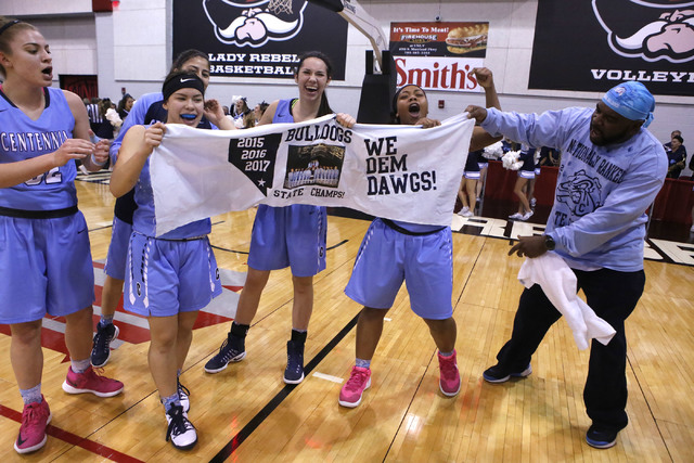 Centennial players celebrate after winning their third straight Class 4A girls state final c ...