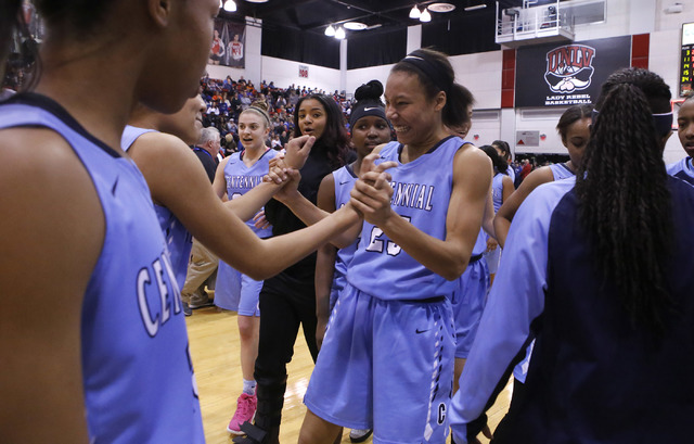 Centennial players celebrate after winning their third straight Class 4A girls state final c ...