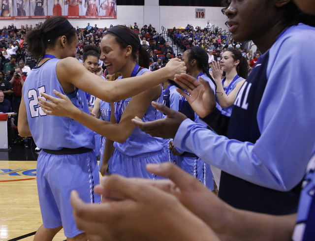 Centennial players celebrate after winning their third straight Class 4A girls state final c ...