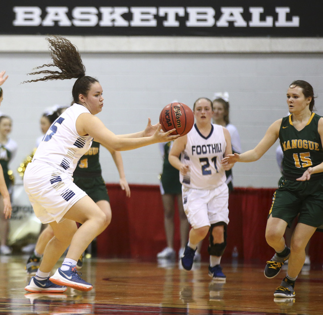 Foothill’s Bri Rosales (15) reels in a pass while playing Bishop Manogue during the Cl ...