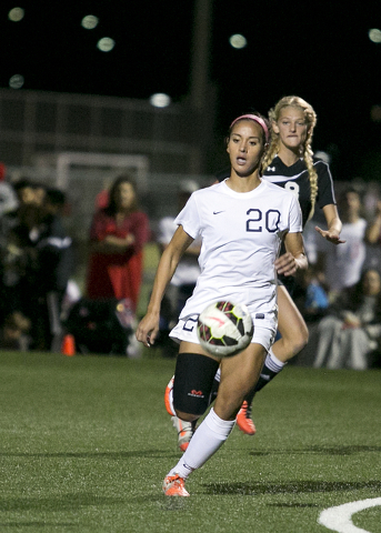 Coronado’s Michaela Morris, front, dribbles the ball and leads Palo Verde’s Alex ...