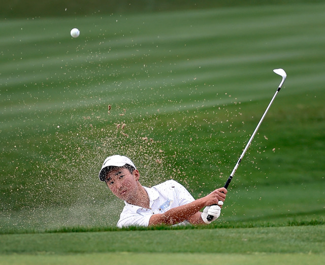 Foothill High School senior golfer Andrew Chu chips out of a bunker during a practice sessio ...