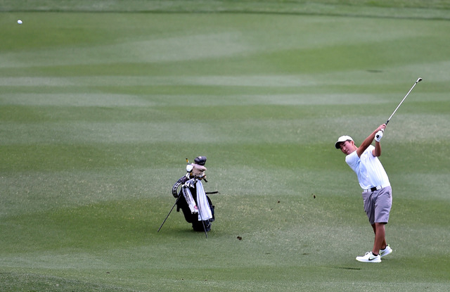 Foothill High School senior golfer Andrew Chu takes his second from the 12th fairway during ...