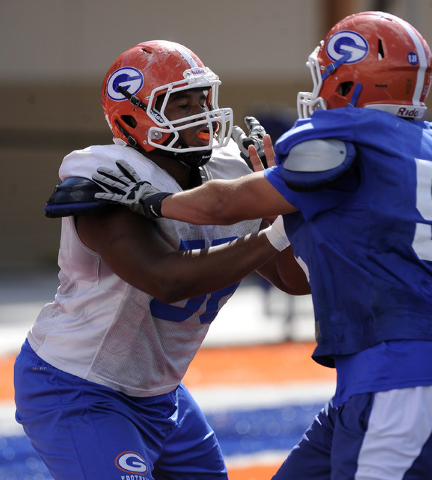 Bishop Gorman senior lineman Jackson Perry, left, shown during practice in August, made an o ...