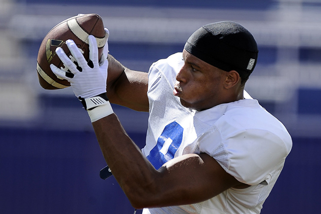 Bishop Gorman senior tight end Alize Jones catches passes while running drills during practi ...