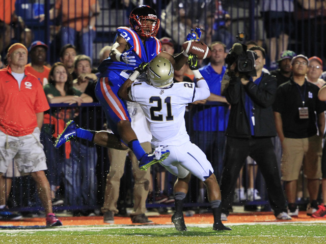 Bishop Gorman wide receiver Cordell Broadus has a pass broken up by St. John Bosco defensive ...