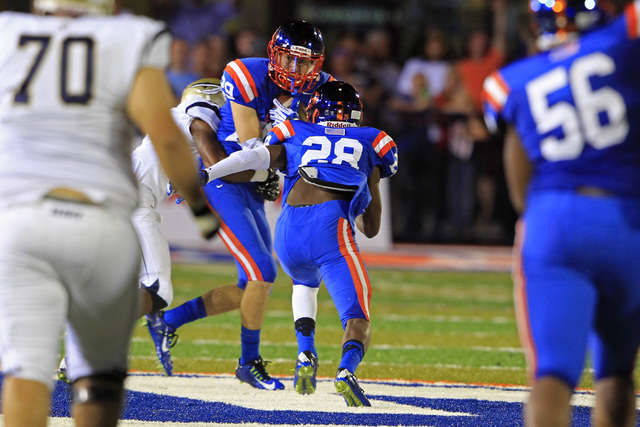 Bishop Gorman safety Bryce Garcia pulls in an interception against St. John Bosco during the ...