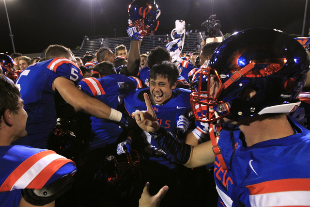 Bishop Gorman celebrate knocking off St. John Bosco, 34-31 at Bishop Gorman on Friday. The G ...