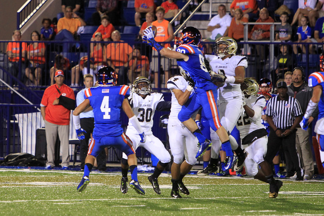 Bishop Gorman Karl Regan grabs and drops an onside kick by St. John Bosco during their game ...