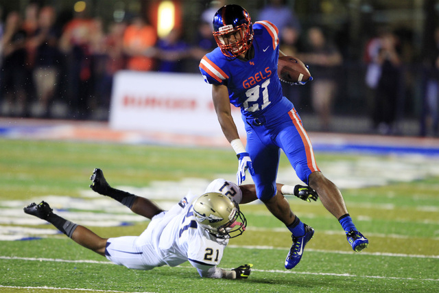 Bishop Gorman wide receiver Cordell Broadus skips past St. John Bosco defensive back Mykal T ...