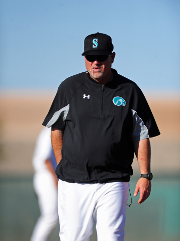 Silverado head coach Brian Whitaker walks to the dugout after making a pitching change in th ...