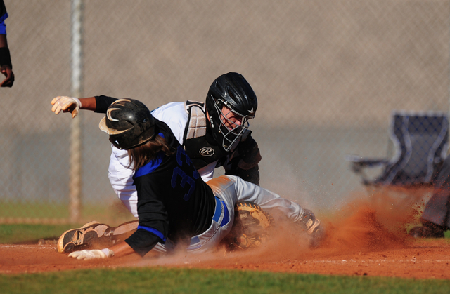 Silverado catcher Michael Camburn tags out Basic base runner Christian Santillanes after San ...