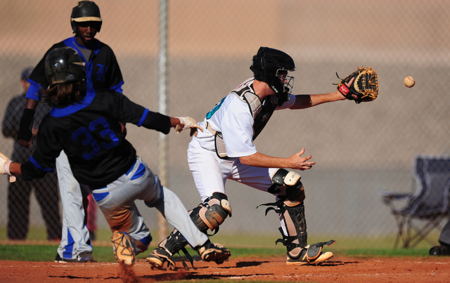 Silverado catcher Michael Camburn tags out Basic base runner Christian Santillanes after San ...