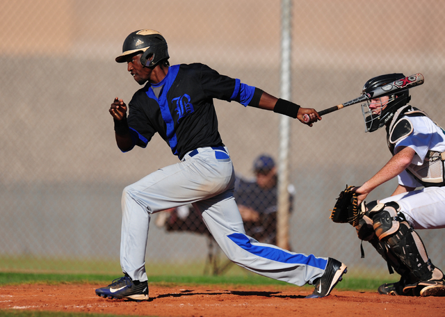 Basic base runner J.J. Smith hits a single in the fifth inning of their prep baseball game a ...