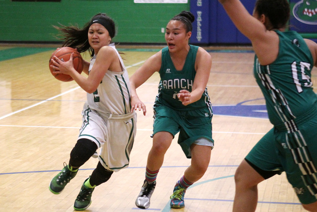 Green Valley guard Gwen Garcia drives past Rancho guard Tatianna Lee during their game Tuesd ...