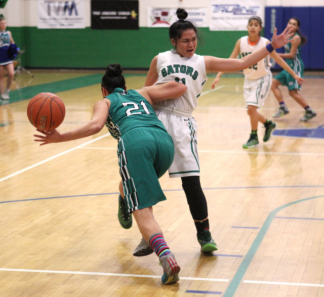 Green Valley guard Gracelle Garcia is shoved by Rancho guard Tatianna Lee during their game ...