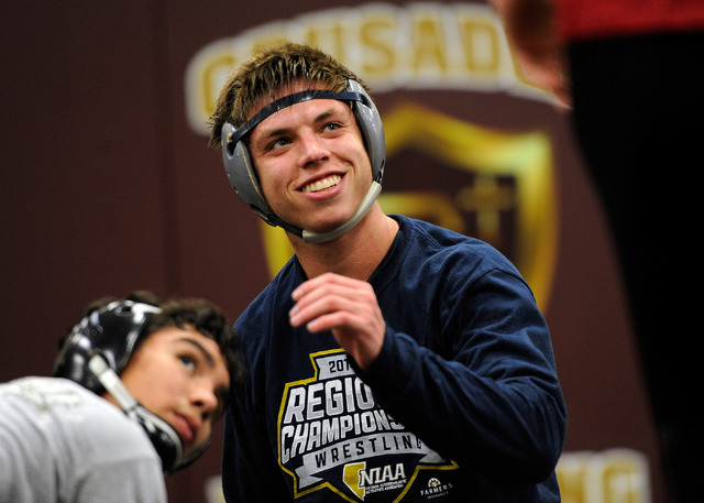 Faith Lutheran wrestler Owen Lawrie, left, smiles during a short break while grappling with ...