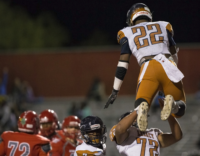 Legacy’s Sam Turner (22) celebrates with Noah Jefferson (72) after scoring a touchdown ...