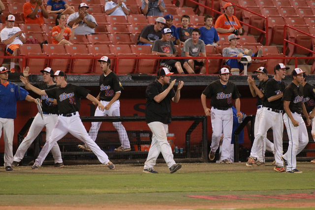 Bishop Gorman players and staff celebrate while playing against Rancho during the American L ...