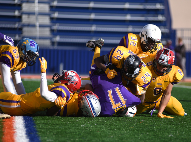 The Sunrise Region defense sacks Sunset quarterback Christian Tasi (17) during the Lions Clu ...