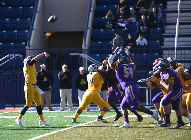 Sunrise Region quarterback Christian Lopez (15) throws a pass in Saturday’s Lions Club ...