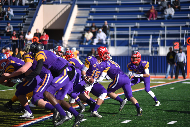 Sunset Region quarterback Bryce Poster (15) takes a snap in the Lions Club All-Star Football ...