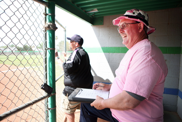 Foothill softball head coach Tom Mayes, right, keeps score in the dugout during a non-league ...