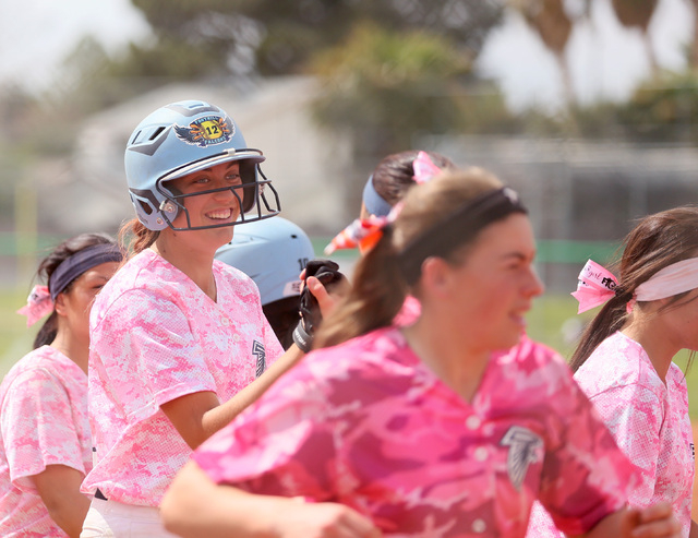 Foothill’s Sarah Maddox, left, celebrates with her teammates after hitting a home run ...