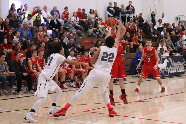 Lincoln County’s Derek Shumway takes a shot to tie their game against The Meadows with ...