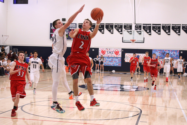 Lincoln County’s McClain O’Connor goes up for a shot while being defended by The ...