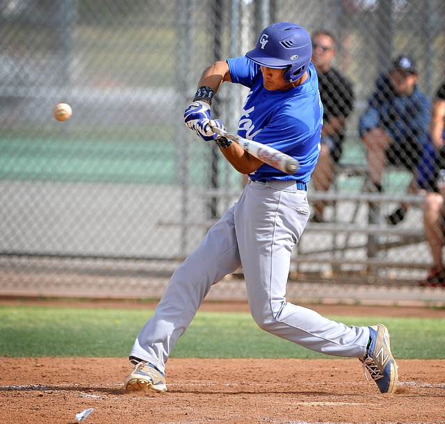 Green Valley’s Keola Paragas swings for the ball during a recent game against Las Vega ...