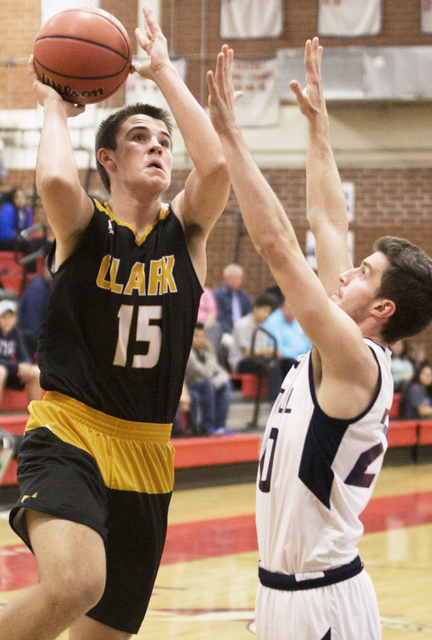 Clark’s James Bridges (15) drives past Foothill’s Jeron Bodin (20) on Tuesday, ...