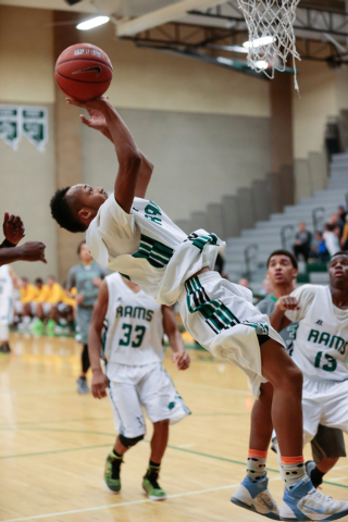 Rancho High School’s David McKeever (1) maneuvers up and around to take a shot in a ga ...