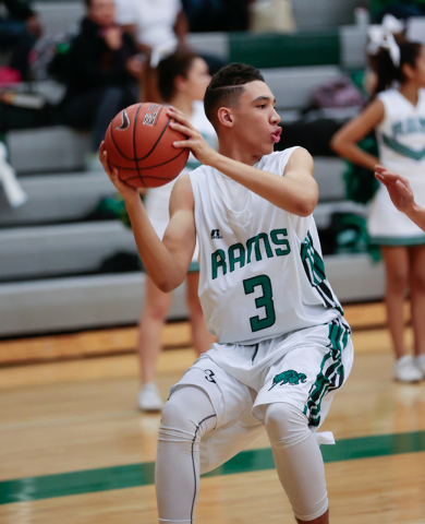 Rancho High School’s Chrys Jackson (3) stops to pass the ball to his teammate during a ...