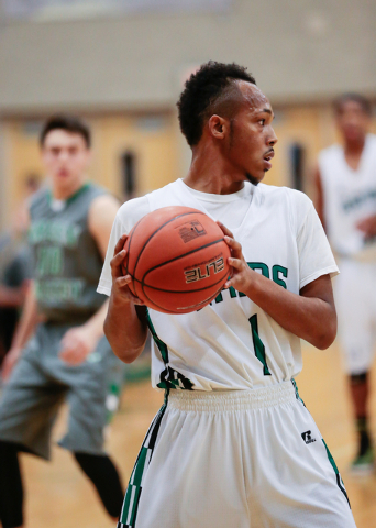 Rancho High School’s David McKeever (1) looks across court for an open teammate during ...