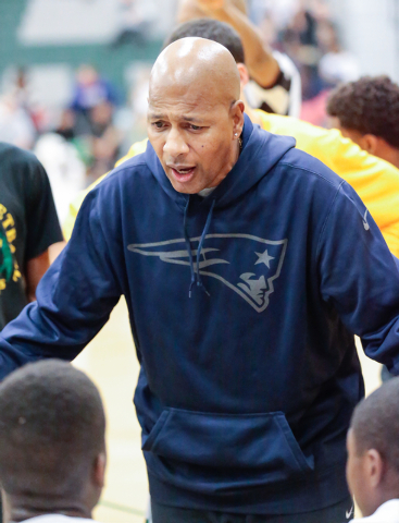 Rancho High School’s Coach Ronald Childress, talks with his players during a timeout a ...