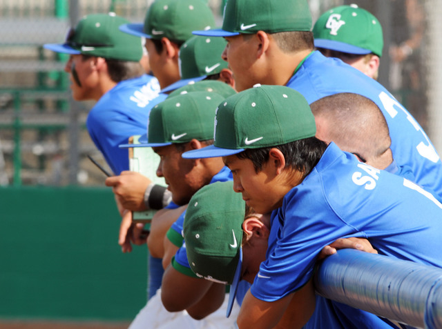 Green Valley’s Eric Samson, foreground, mirrors the gloom in the team’s dugout d ...