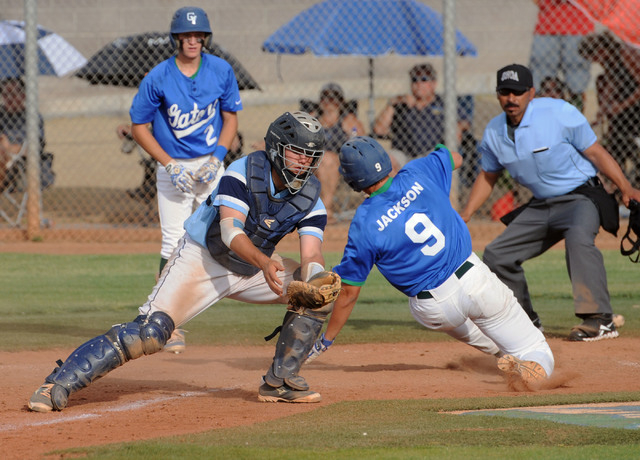 Green Valley’s Ryan Jackson (9) scores the go-ahead run as Foothill catcher Zach Avery ...